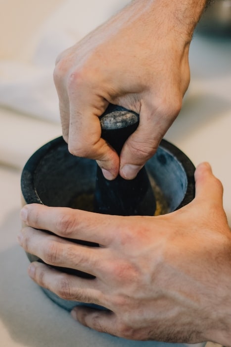 A mortar and pestle is a great tool to use for blender when you don't have a blender.